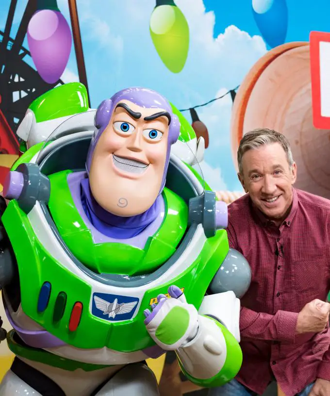 Tim Allen poses with Buzz Lightyear for Toy Story Land