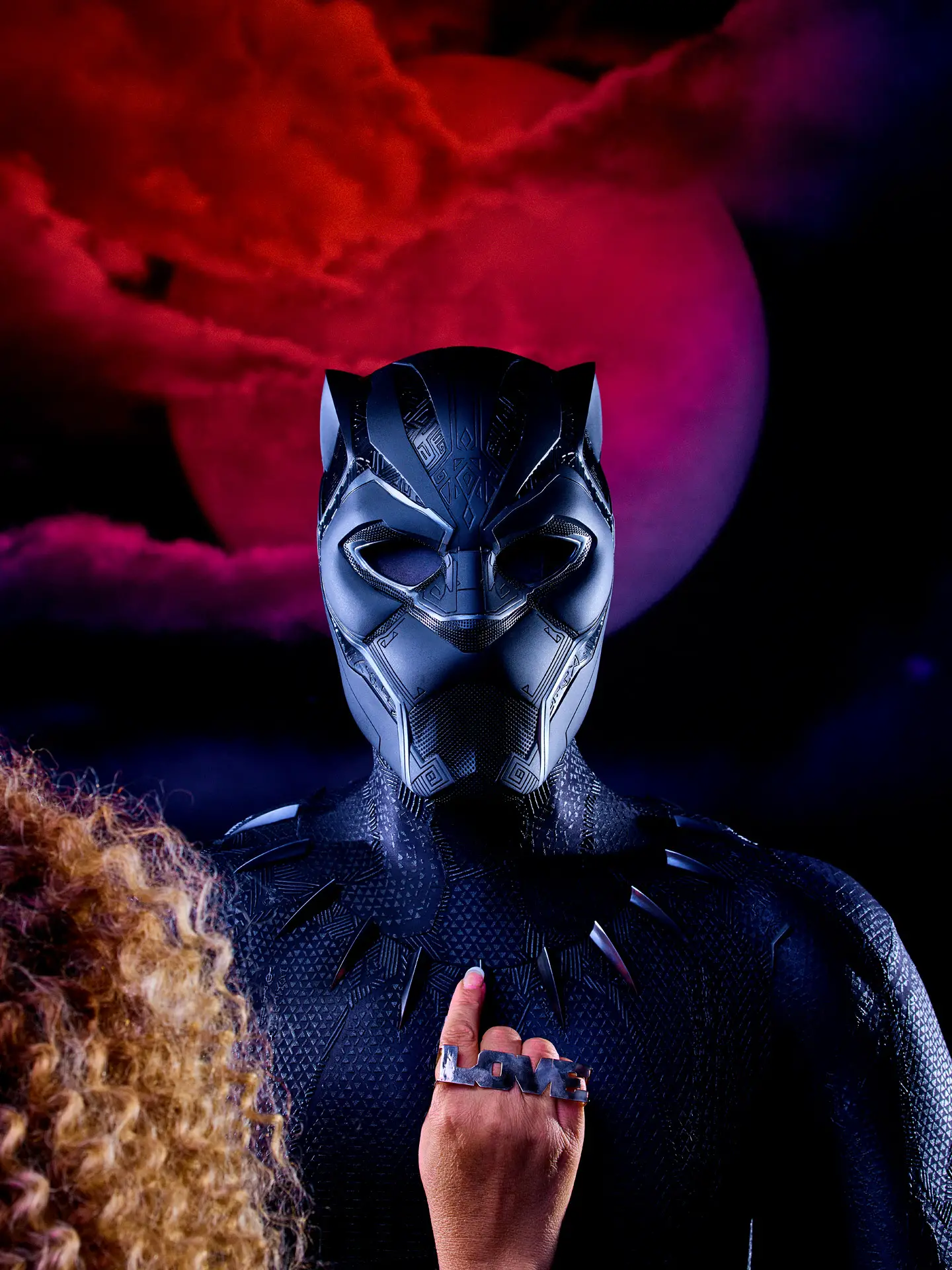 Ruth E. Carter in front of Black Panther costume