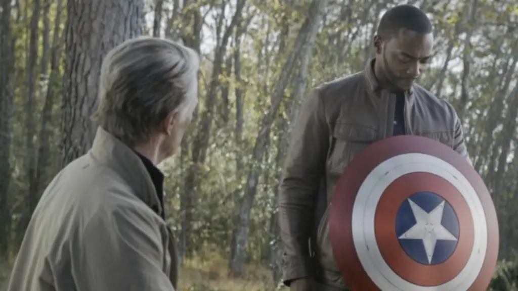 Captain America Hands Off the Shield to Falcon