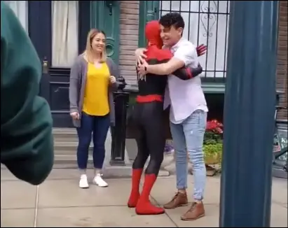 tom holland surprised hugs at Disneyland