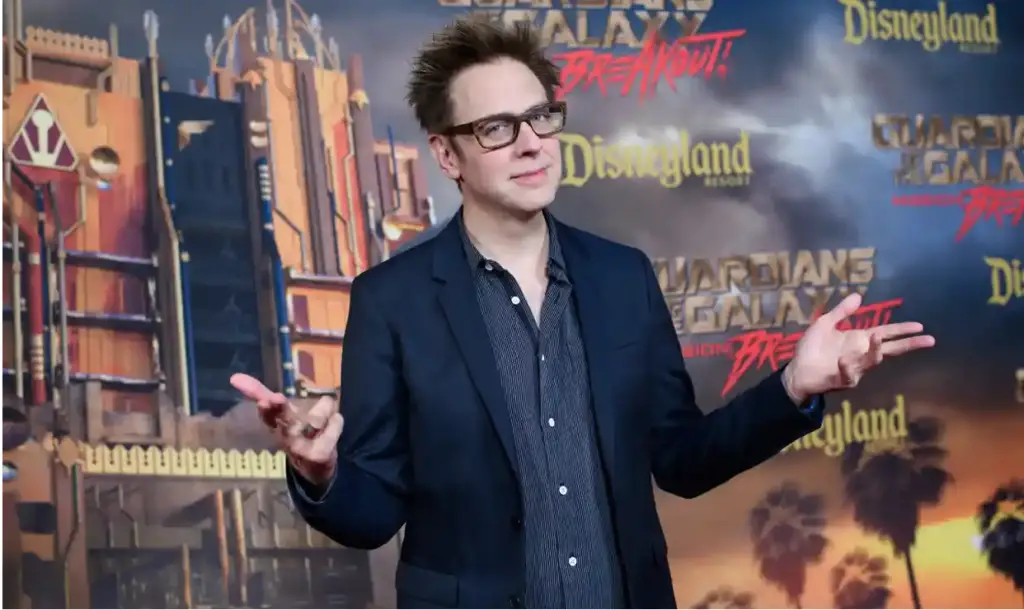 James Gunn in front of Mission Breakout background Iwuji's