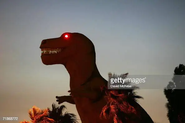 A roadside attraction dinosaur towers over the desert near the San Andreas Fault
